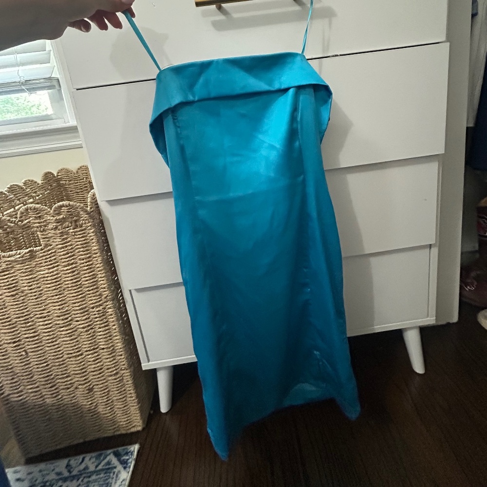 blue woman’s strapless mini dress